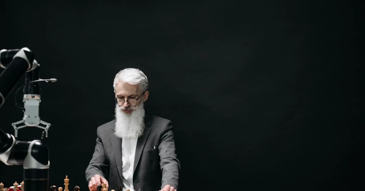 An elderly man competes against a robotic arm in a chess game, symbolizing the intersection of technology and strategy.